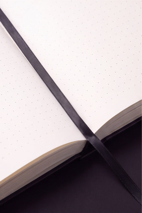The Engineer's Field Book lying flat when open, showing the binding and ribbon bookmark